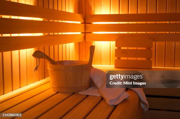 bucket and towels in sauna - sauna ストックフォトと画像