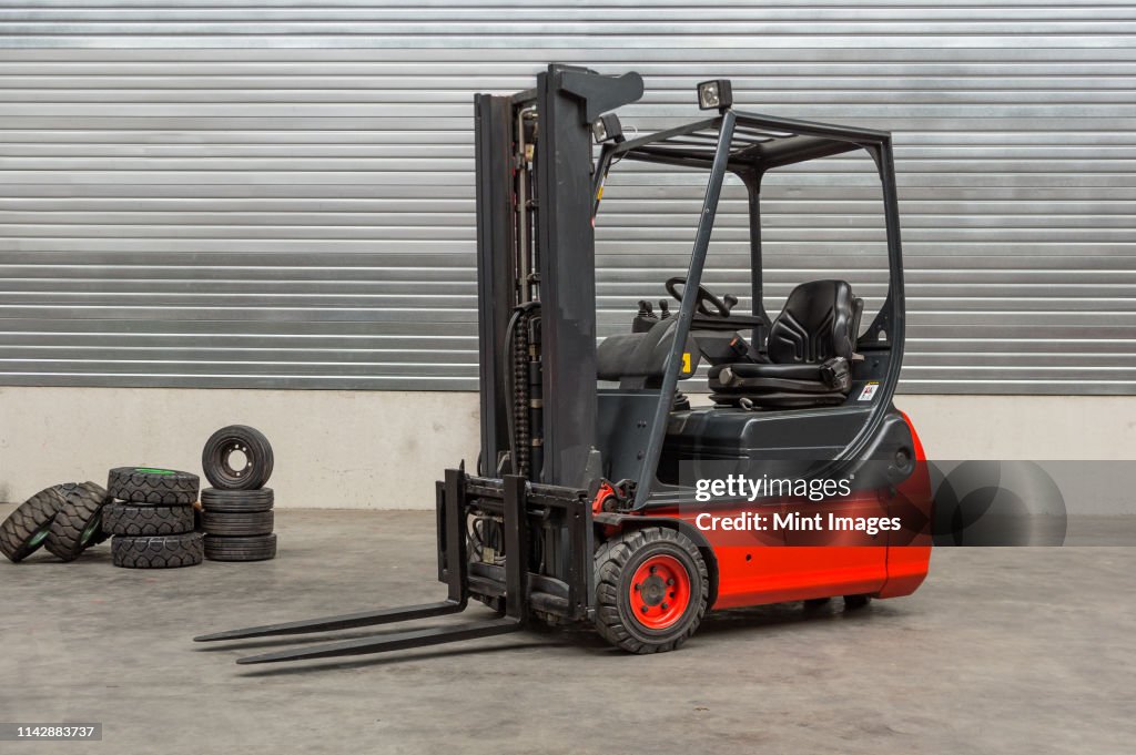 Forklift machinery parked in warehouse