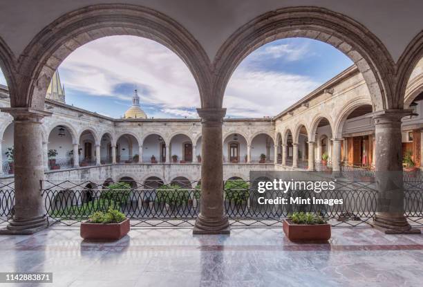 arches and courtyard of governor's palace, guadalajara, jalisco, mexico - guadalajara mexico stock pictures, royalty-free photos & images