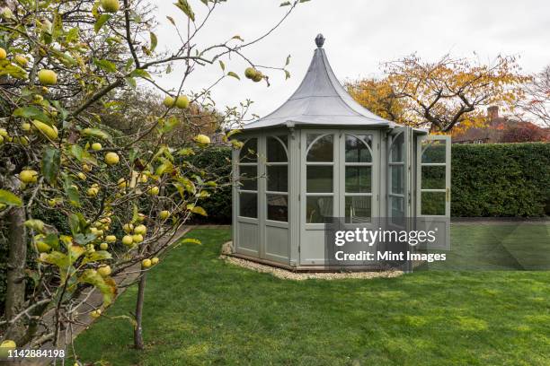 ornate gazebo in backyard - gazebo stock pictures, royalty-free photos & images