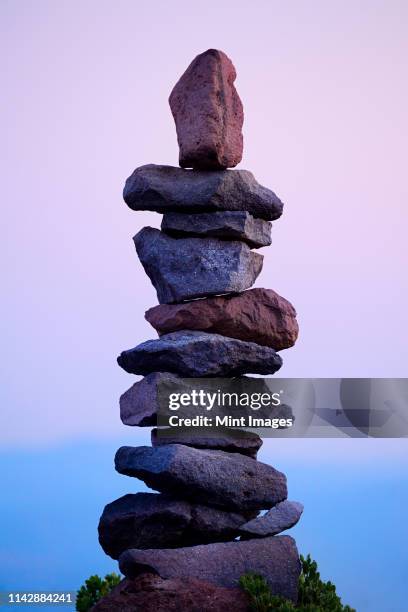 rocks stacked neatly in rural landscape - trail marker stock pictures, royalty-free photos & images