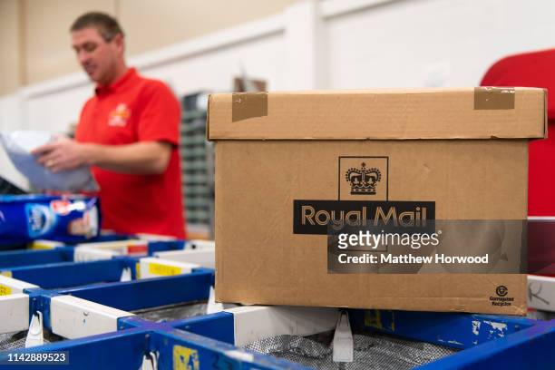 Royal Mail workers at work in a Royal Mail sorting office on February, 2 2019 in Cardiff, United Kingdom.