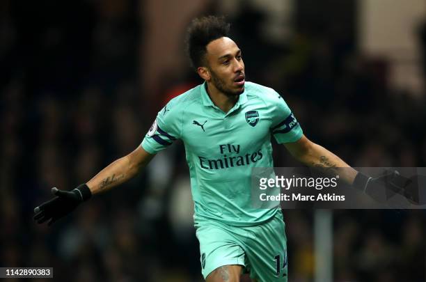 Pierre-Emerick Aubameyang of Arsenal celebrates scoring his side's first goal during the Premier League match between Watford FC and Arsenal FC at...