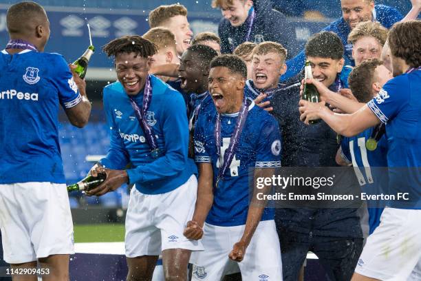 Everton U23's celebrate after lifting the Premier League 2 trophy at Goodison Park on April 15, 2019 in Liverpool, England.