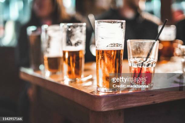 close-up of drinks on a table - alcohol abuse stock pictures, royalty-free photos & images