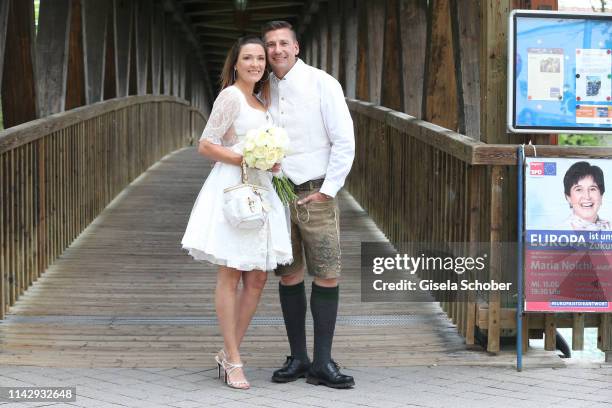 Bride Simone Ballack and her husband Andreas Mecky during their civil wedding at city hall on May 11, 2019 in Wolfratshausen, Germany.