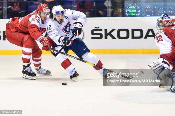 Oliver Lauridsen of Denmark checks Valentin Claireaux of France during the 2019 IIHF Ice Hockey World Championship Slovakia group A game between...