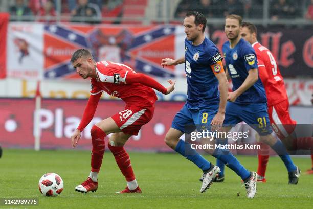 Kilian Pagliuca of Halle challenges for the ball with Stephan Fuerstner of Braunschweig during the 3. Liga match between Hallescher FC and Eintracht...