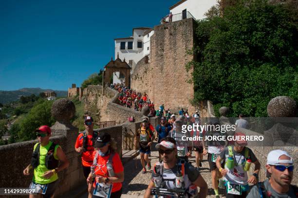 Runners take part in the XXII 101km international cross-country competition in Ronda on May 11, 2019. - About 8,500 participants, including runners...