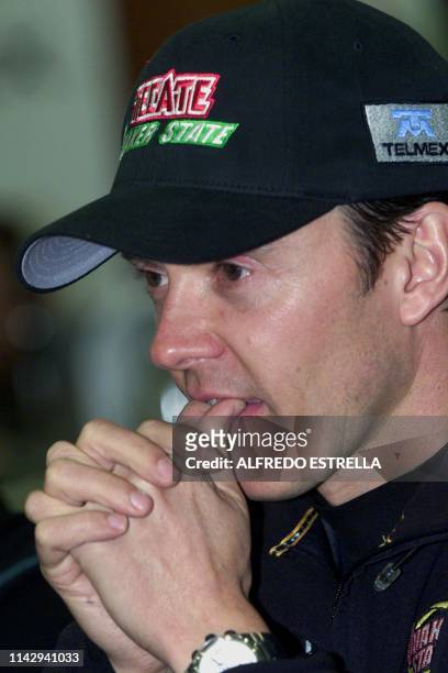 Cart driver Adrian Fernandez from Mexico answers questions during a press conference 14 November 2002 in Mexico City. Training begins 15 November for...