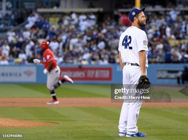 Clayton Kershaw of the Los Angeles Dodgers reacts to a two run homerun from Yasiel Puig for a 2-0 lead during the first inning on Jackie Robinson Day...