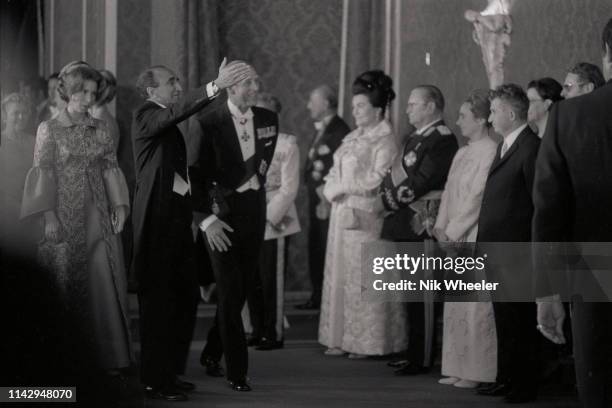 Prince Philip and daughter Princess Anne enter reception hall containing largest assembly of dignitaries, royalty and Heads of State , including...