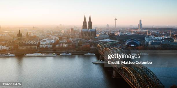 panoramic of skyline at sunset, cologne, germany - köln skyline stock pictures, royalty-free photos & images