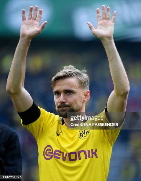 Dortmund's German defender Marcel Schmelzer celebrates after his team won the German first division Bundesliga football match Borussia Dortmund vs...
