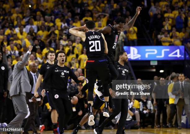 Landry Shamet of the LA Clippers is congratulated by Patrick Beverley after he made a basket to put the Clippers ahead of the Golden State Warriors...