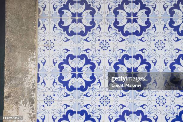 tiled wall with floral pattern. lisbon, portugal. - portuguese tiles stock pictures, royalty-free photos & images