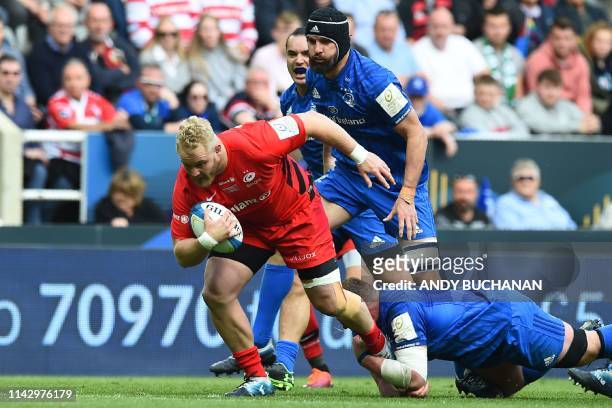 Saracens' English flanker Jackson Wray is tackled by Leinster's Irish prop Tadhg Furlong during the European Rugby Champions Cup final match between...