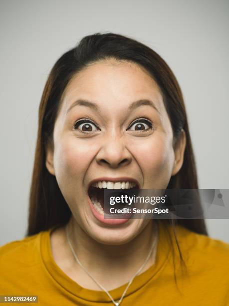 porträtt av riktiga malaysiska ung kvinna med skrika uttryck - expressive eyes bildbanksfoton och bilder