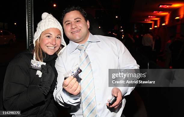 Guests pose for photos during the distribution of Ciroc debit cards for yellow cab fares on New Year's Eve hosted by Ciroc Vodka on December 31, 2008...