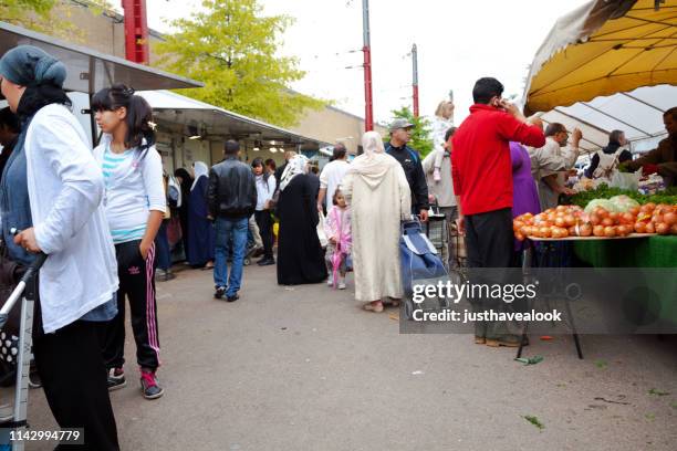 multi-ethnic group on weekend market brussels midi - islam stock pictures, royalty-free photos & images