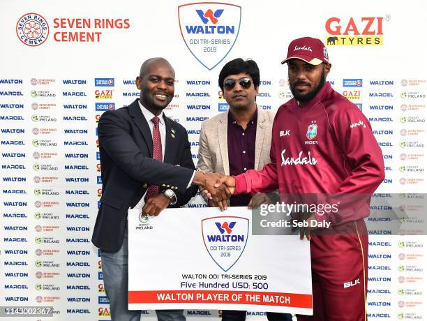 Dublin , Ireland - 11 May 2019; Sunil Ambris of West Indies is presented with his Man of the Match award by Dr Kishore Shallow, Vice President of...