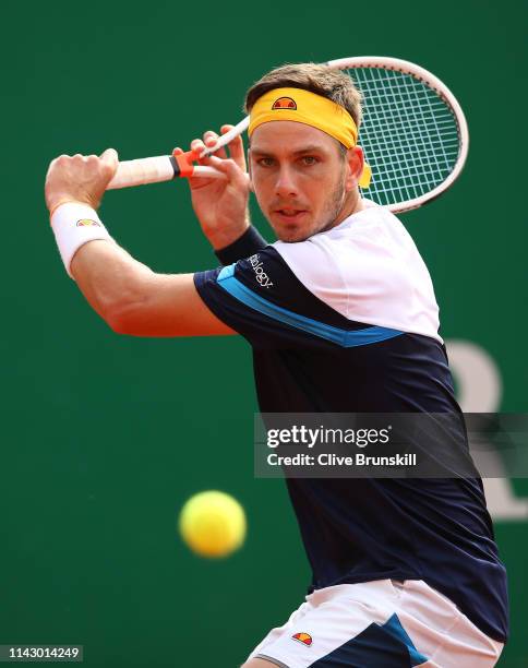 Cameron Norrie of Great Britain plays a backhand against Adrian Mannarino of France in their first round match during day 3 of the Rolex Monte-Carlo...