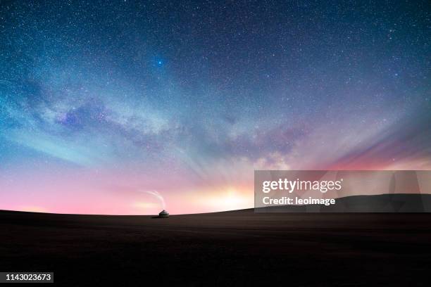 milky way over prairie - grand dreamer stock pictures, royalty-free photos & images