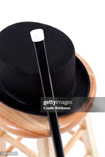 top hat and cane on a wooden stool - dance cane stock pictures, royalty-free photos & images