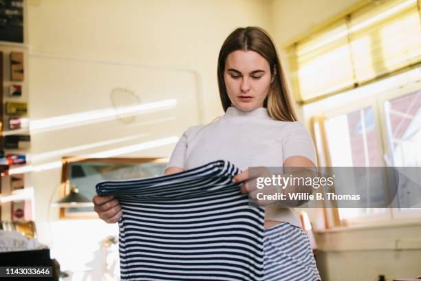 woman deciding what to wear - buxom blonde fotografías e imágenes de stock