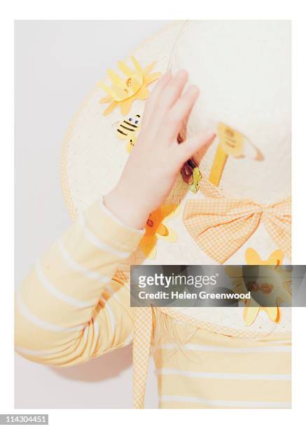 young girl wearing easter bonnet - easter bonnet stock-fotos und bilder