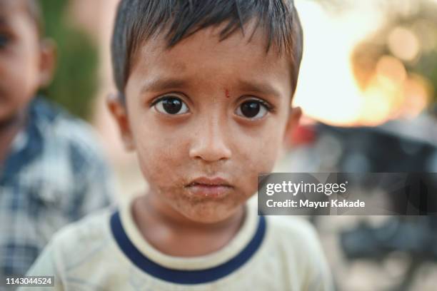 portrait of a young boy from rural india - indian boy portrait stockfoto's en -beelden