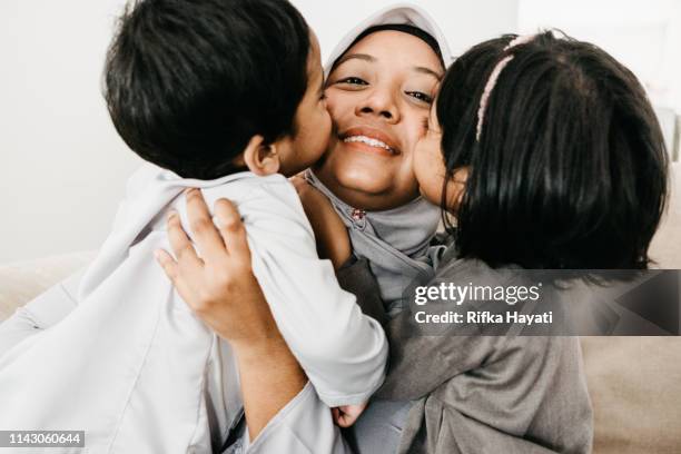 muslim family - mom and us - muslim stock pictures, royalty-free photos & images