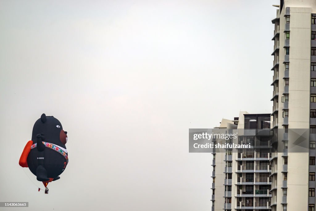 Morning view with hot balloons over condominium at Putrajaya.