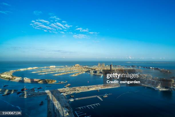 aerial view of palm island in dubai - dubai palm stock pictures, royalty-free photos & images