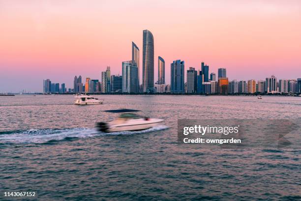 urban skyline in abu dhabi - abu dhabi skyline stock pictures, royalty-free photos & images