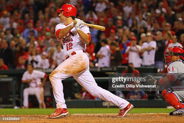 Lance Berkman of the of the St. Louis Cardinals hits a walk-off single against the Philadelphia Phillies Busch Stadium on May 17, 2011 in St. Louis,...