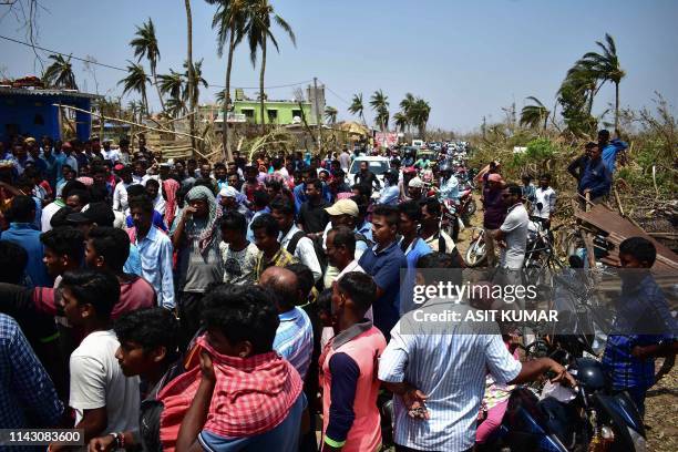 Indian villagers block the national highway connecting Puri to Bhubaneswar as they demand relief materials after the "Fani" cylone hit villages near...