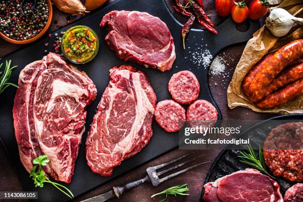 various cuts of raw meat shot from above - different cuts of meat stock pictures, royalty-free photos & images