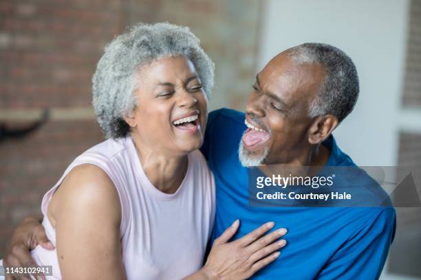 happy african american senior couple laughing and enjoying time together - flirting gym stock pictures, royalty-free photos & images