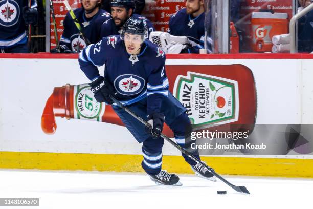 Par Lindholm of the Winnipeg Jets plays the puck up the ice during first period action against the St. Louis Blues in Game Two of the Western...