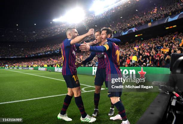 Lionel Messi of Barcelona celebrates after scoring his team's first goal with Philippe Coutinho of Barcelona and Jordi Alba of Barcelona during the...