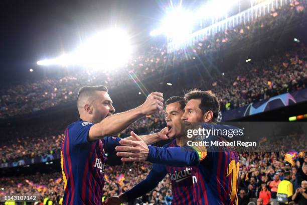 Lionel Messi of Barcelona celebrates after scoring his team's first goal with Philippe Coutinho of Barcelona and Jordi Alba of Barcelona during the...