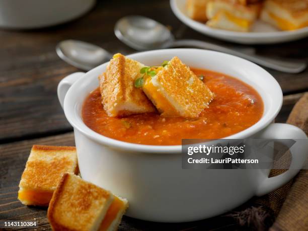 roasted tomato, garlic and basil soup with grilled cheese croutons - comfort food stock pictures, royalty-free photos & images