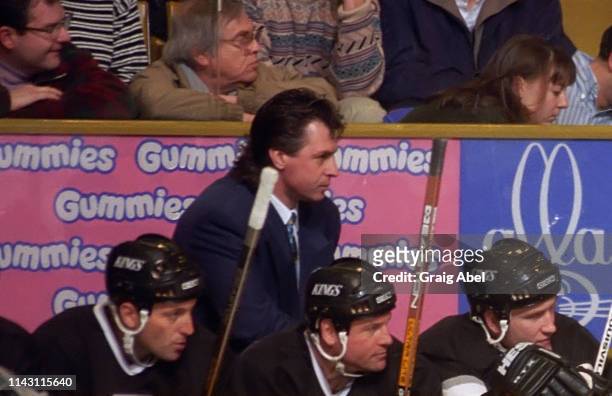 Head coach Barry Melrose of the Los Angeles Kings watches the play against the Toronto Maple Leafs during NHL game action on February 11, 1995 at...