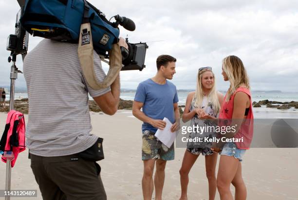 Australian TV presenter James Tobin was given a surfing lesson by Laura Enever of Hawaii and Courtney Conlogue of the USA on a layday at the 2014...