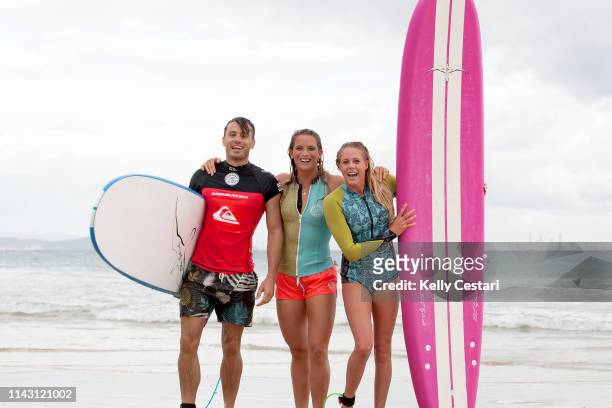 Australian TV presenter James Tobin was given a surfing lesson by Laura Enever of Hawaii and Courtney Conlogue of the USA on a layday at the 2014...