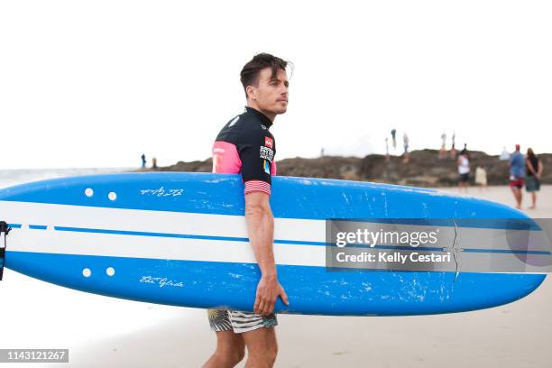 Australian TV presenter James Tobin was given a surfing lesson by Laura Enever of Hawaii and Courtney Conlogue of the USA on a layday at the 2014...