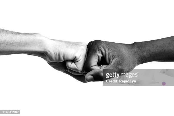 interracial fists collide - respect stock pictures, royalty-free photos & images