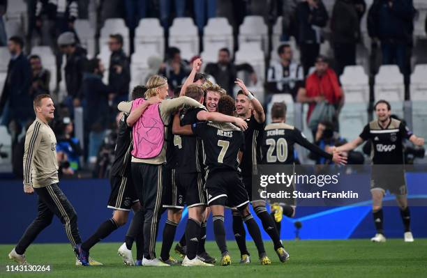 The Ajax team celebrate winning the UEFA Champions League Quarter Final second leg match between Juventus and Ajax at Allianz Stadium on April 16,...