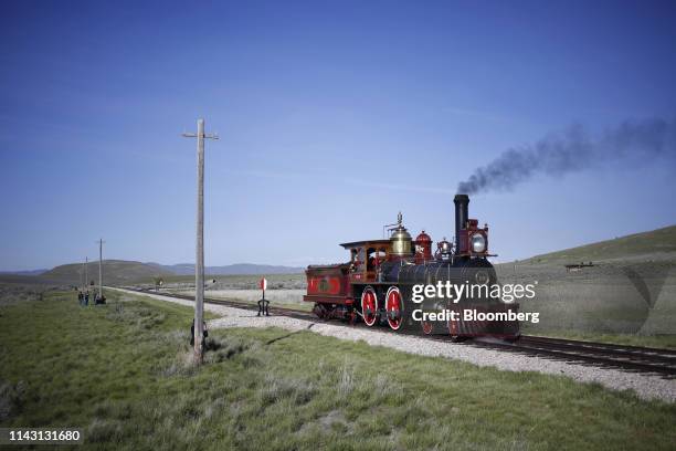 The steam locomotive Union Pacific No. 119 moves down a track during a celebration of the 150th anniversary of the completion of the transcontinental...